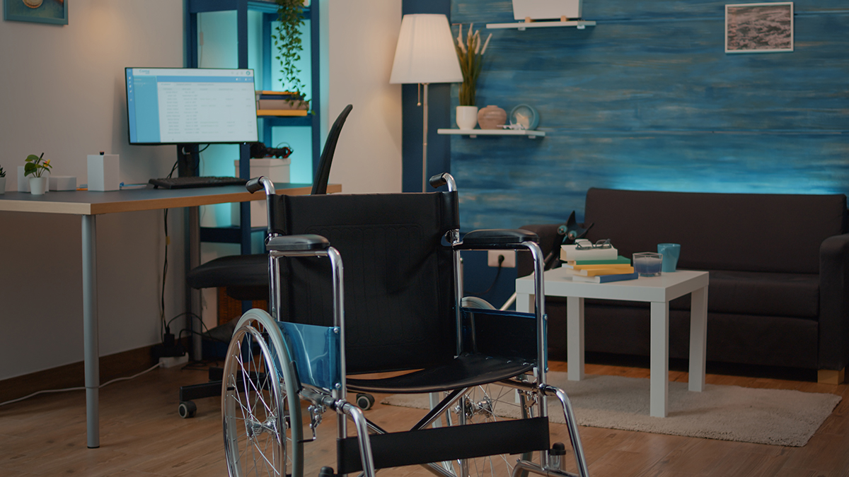 empty-living-room-with-wheelchair-help-with-chronic-disability-injury-nobody-space-with-transportation-object-give-support-patient-help-with-accessibility-physical-recovery.jpg