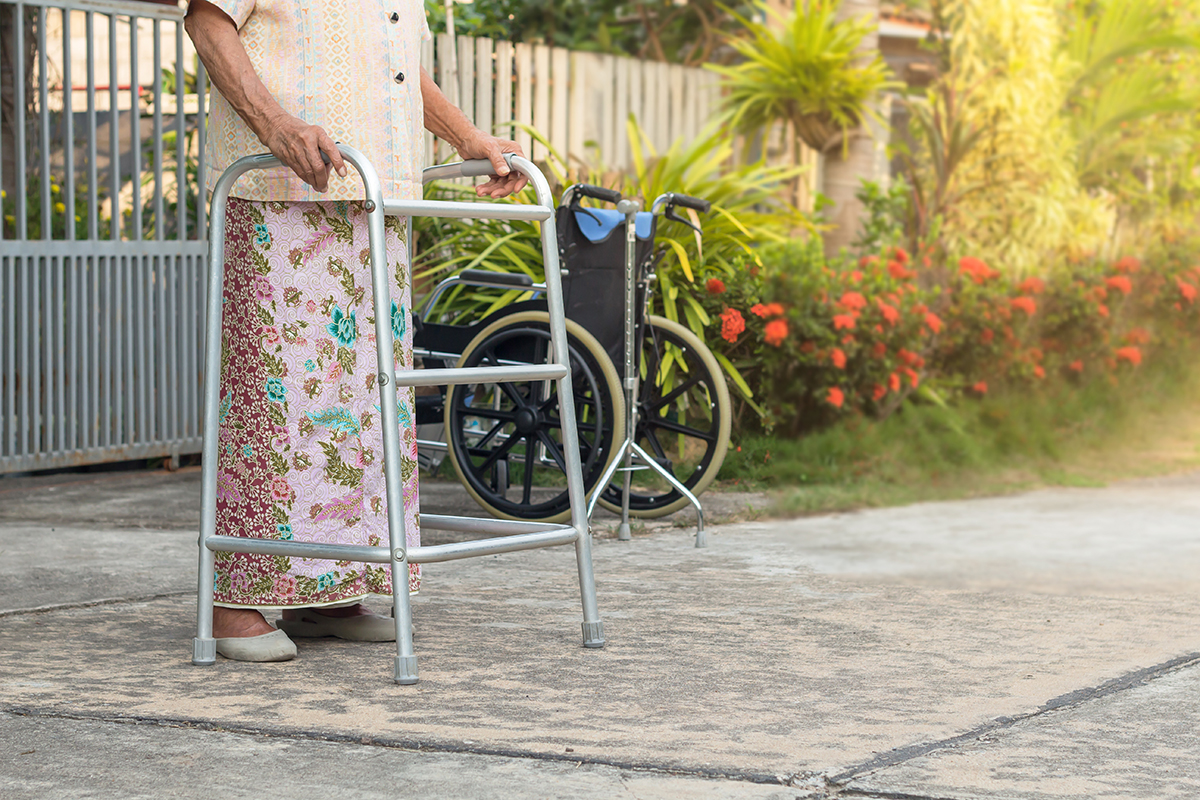 asian-old-woman-standing-with-his-hands-walking-stick (1).jpg